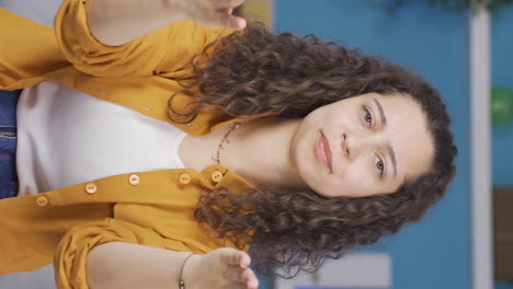 Vertical-video-of-Young-woman-getting-angry-at-camera.